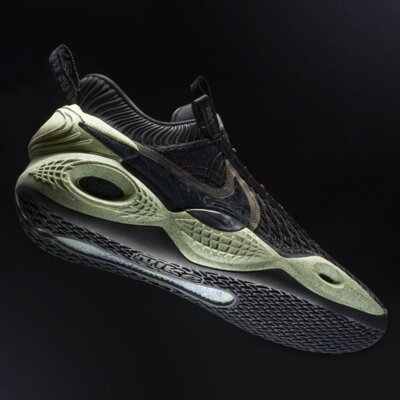 Nike Cosmic Unity sneaker photograph with a dark background and sharp lighting.